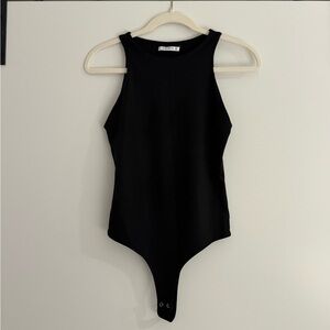 Black high-neck sleeveless bodysuit